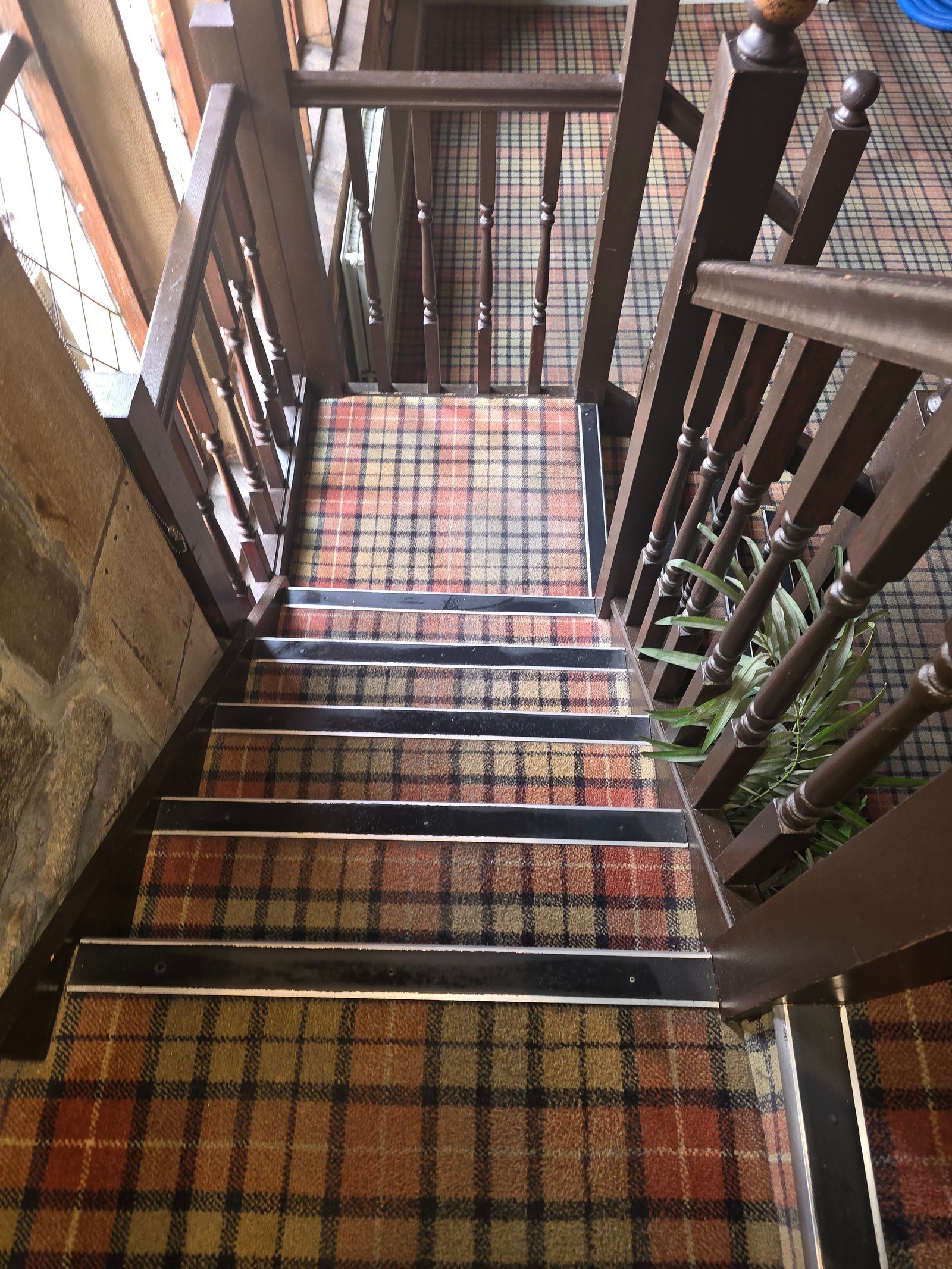 Tartan staircase carpet at The Stansfield Arms after professional deep cleaning by Esteamed