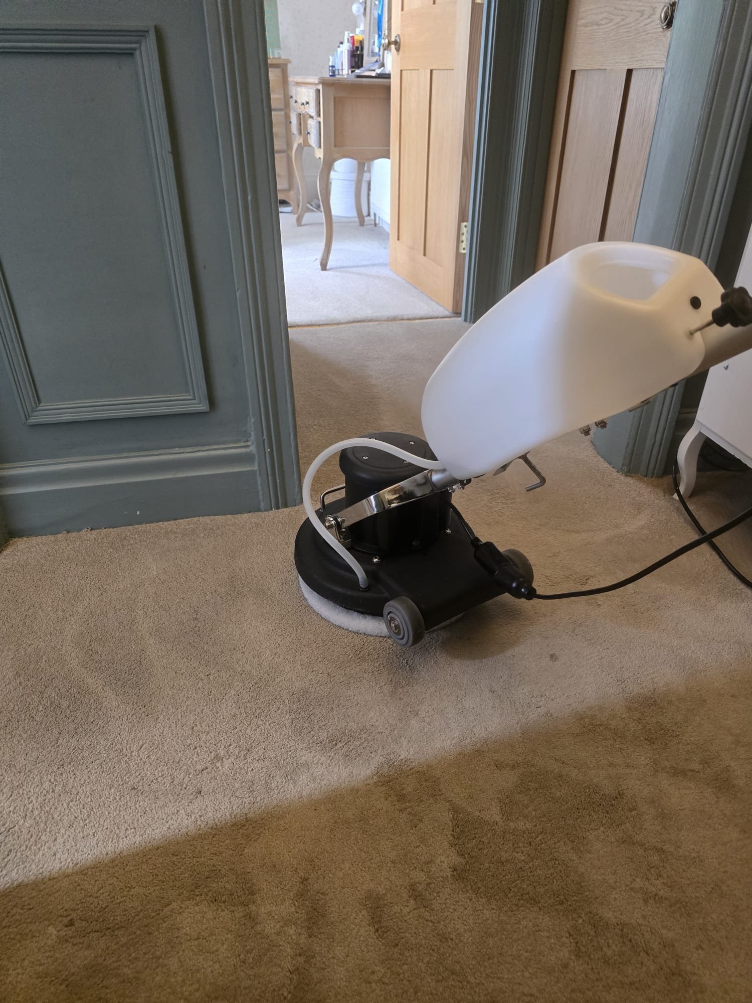 Carpet cleaning in action at Dyneley Hall showing before and after results on the landing