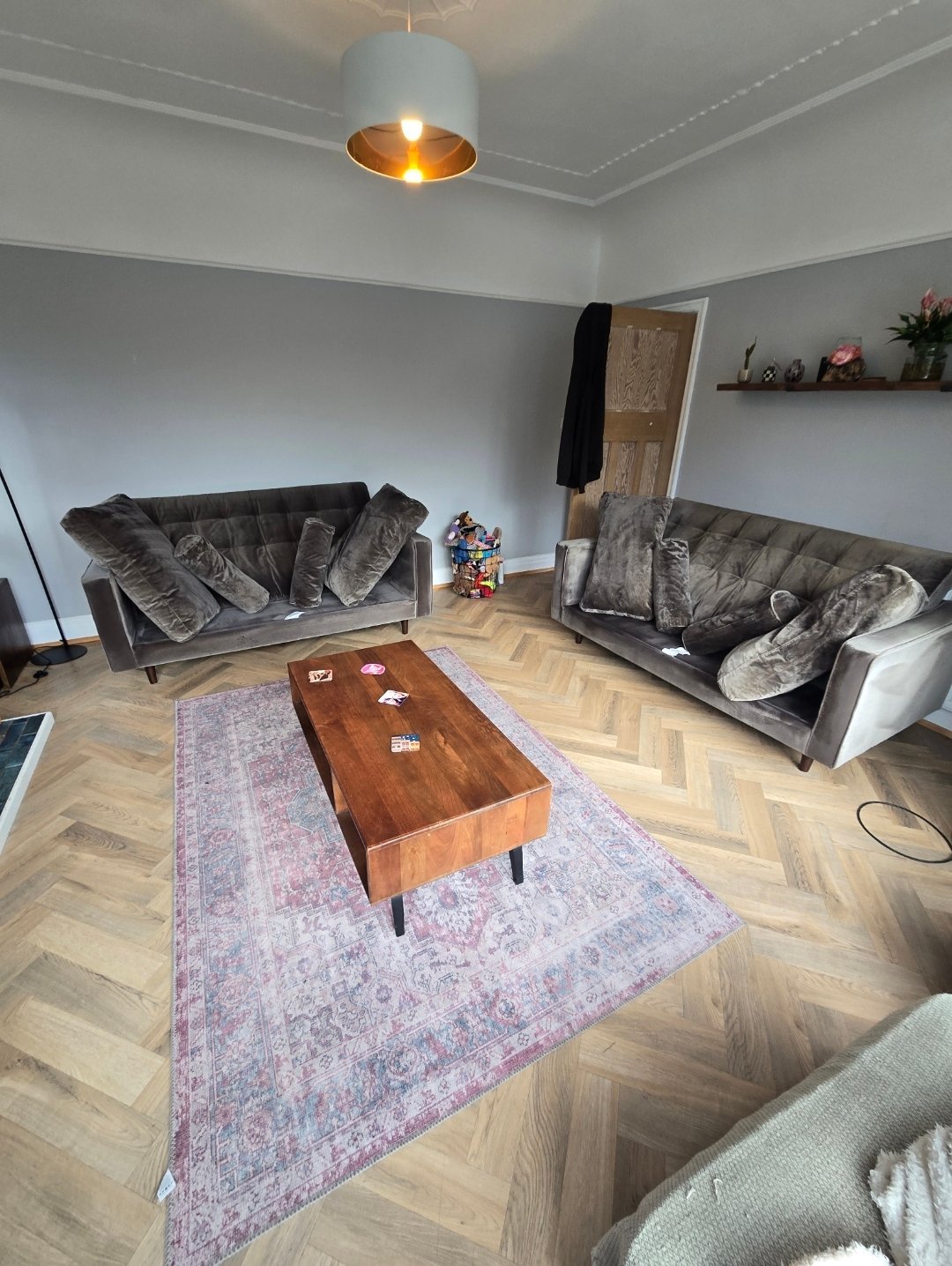 Two grey velvet sofas with patterned rug after professional upholstery cleaning in Guiseley