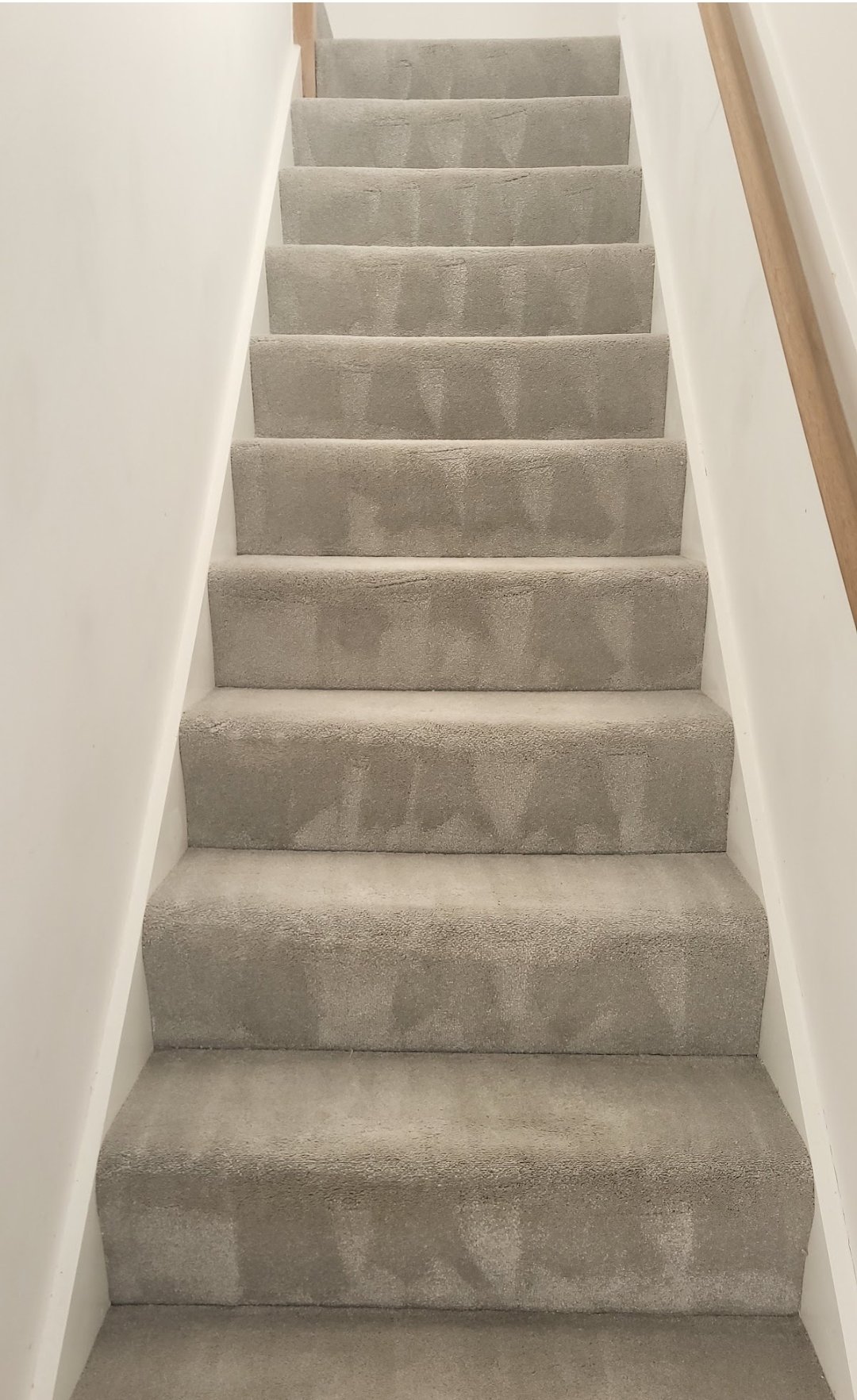 Grey carpeted stairs professionally cleaned in a Harrogate home