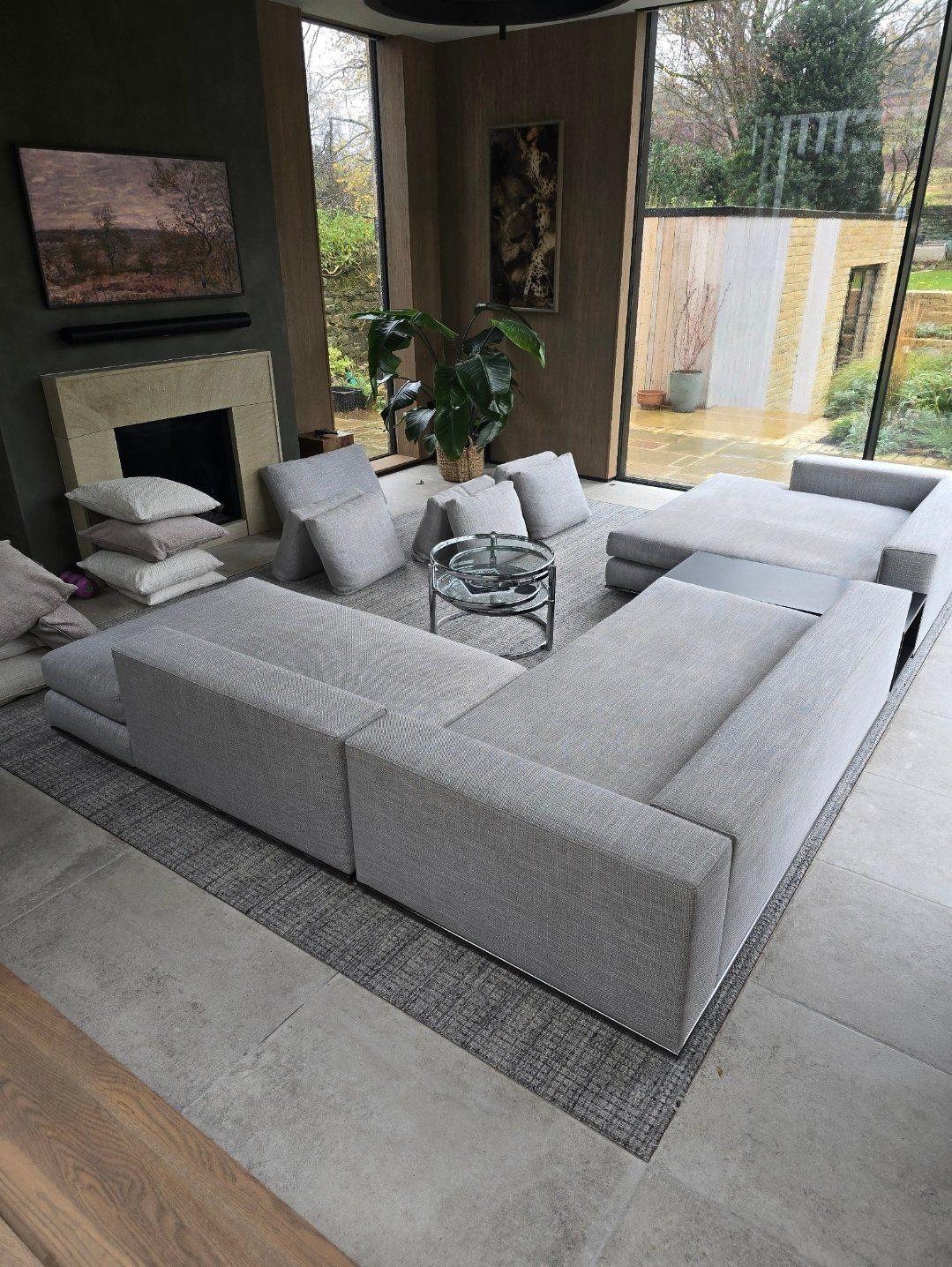 Luxury modern lounge with grey sectional sofa and clean carpet after professional cleaning in Ilkley