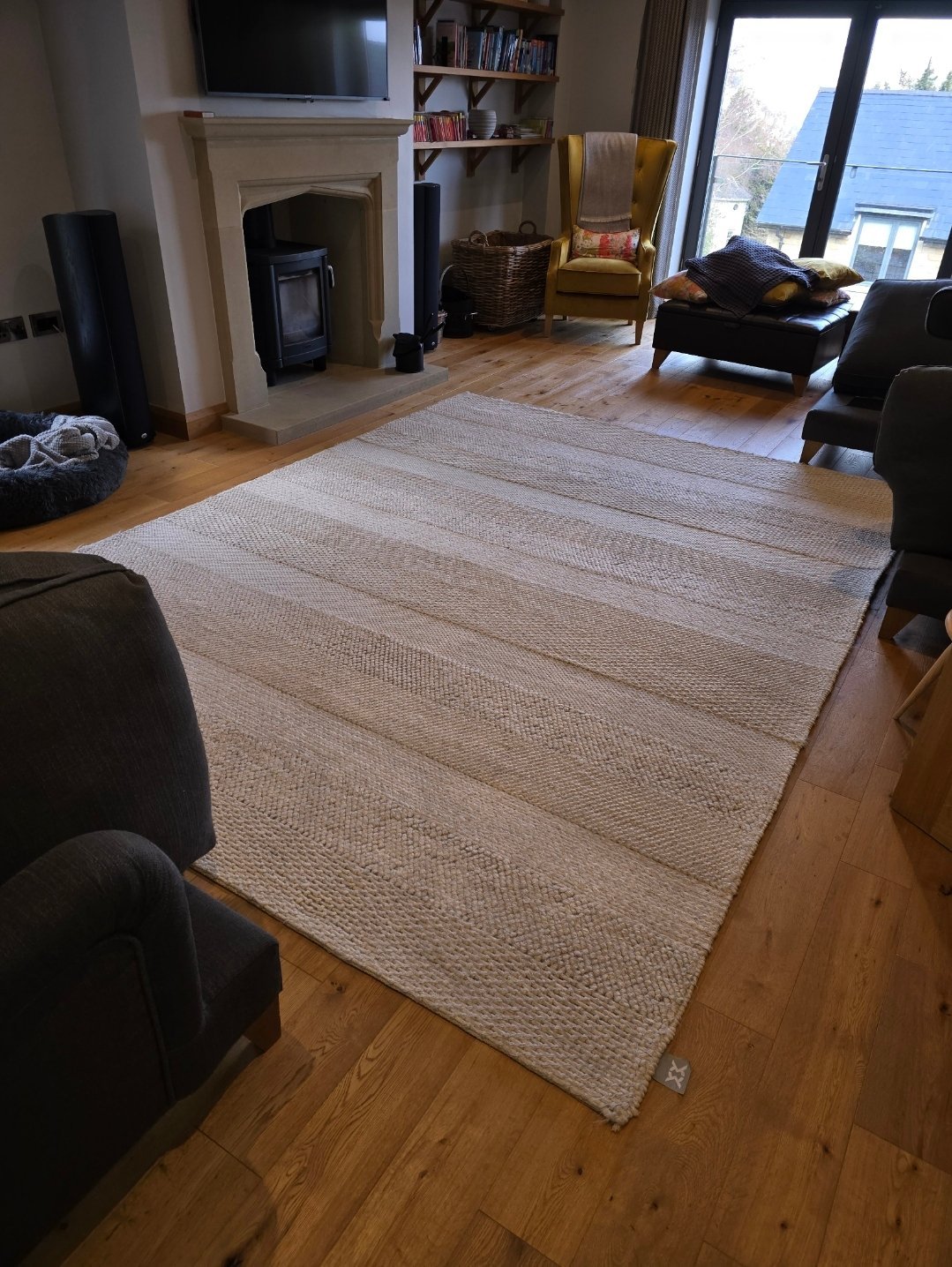Large textured area rug on wooden floor after cleaning in an Ilkley home