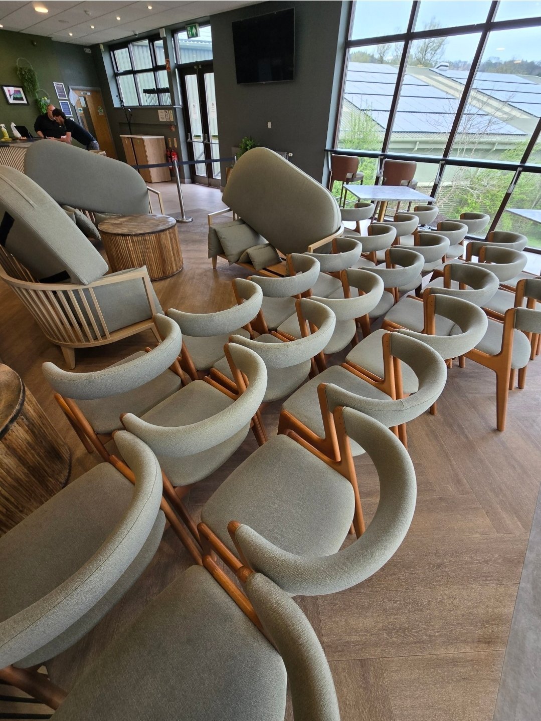 Commercial upholstery cleaning of grey fabric chairs at a venue in Ilkley