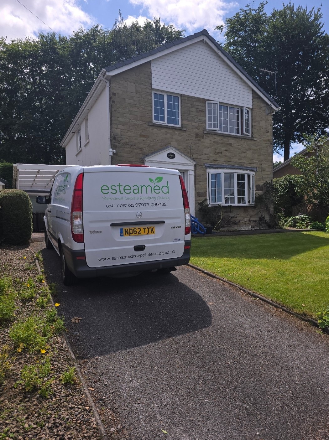 Esteamed branded van parked at a detached stone house in Ilkley