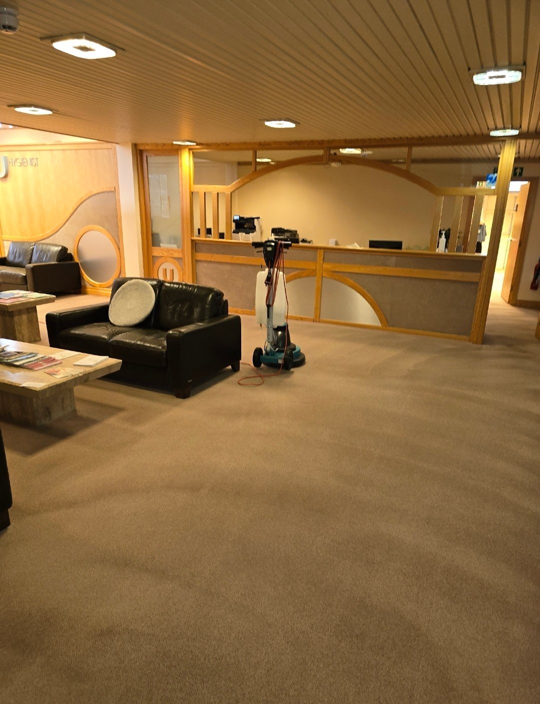 Commercial carpet cleaning in a reception area with cleaning machine in Ilkley